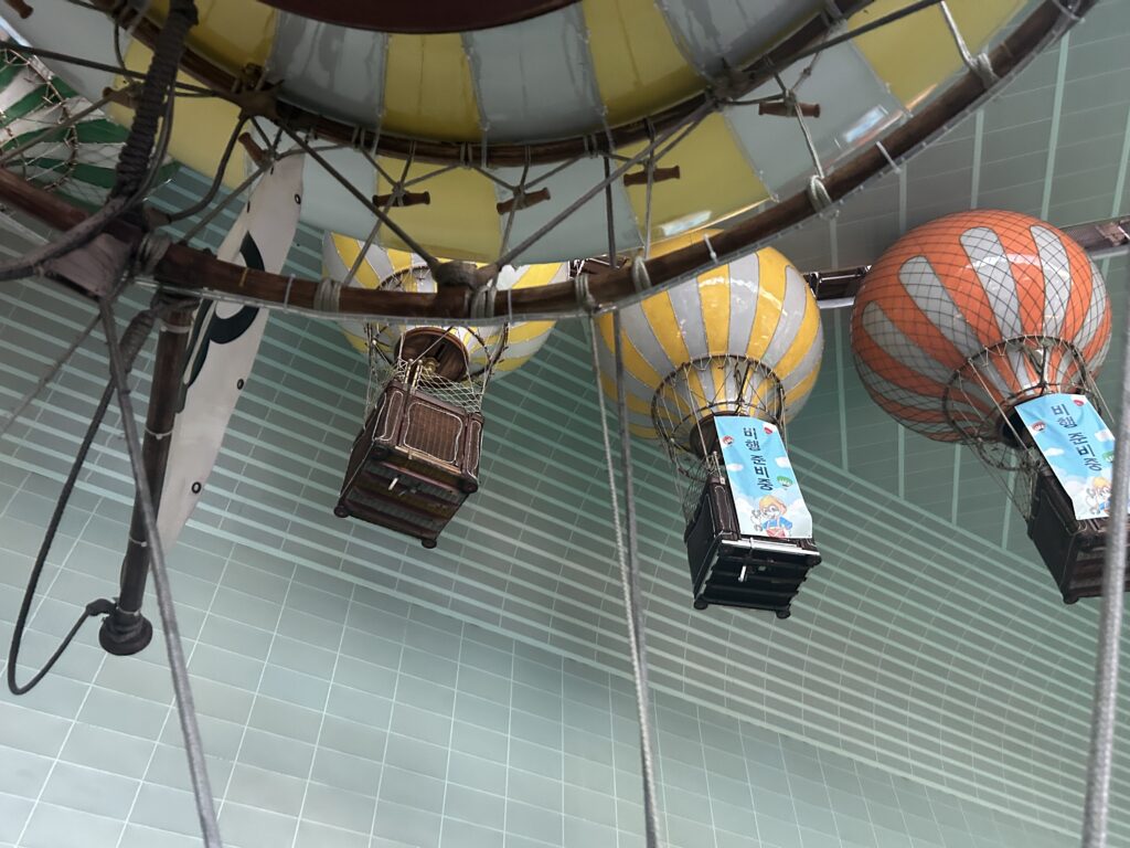 Indoor roller coaster with Christmas decorations at Lotte World Adventure